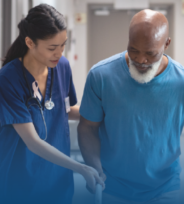Image of woman health care provider assisting an older man using a walker, as example of Blue Cross’ commitment to members and employer customers Image of woman health care provider assisting an older man using a walker, as example of Blue Cross’ commitment to members and employer customers
