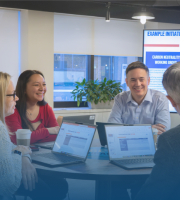 Five Blue Cross Blue Shield of MA employees are seated at a conference table and smiling, representing the company’s commitment to its people Five Blue Cross Blue Shield of MA employees are seated at a conference table and smiling, representing the company’s commitment to its people