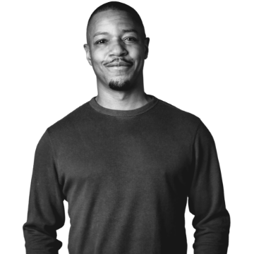 Man with clasped hands wearing jacket